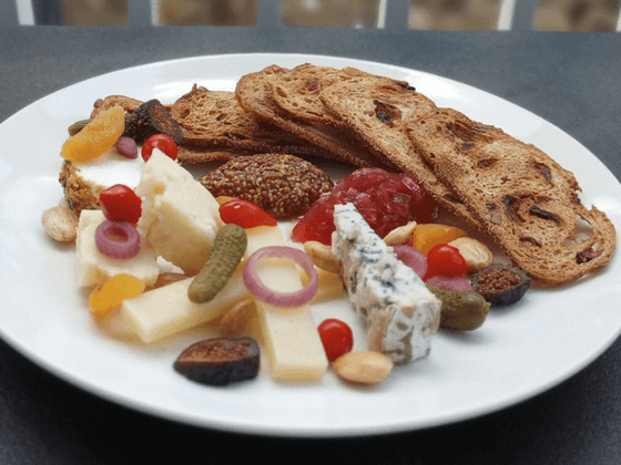 Close-up of cheese platter on a table at the inn at Willow grove