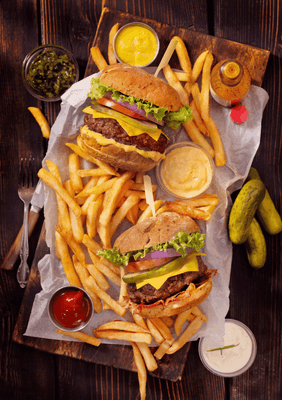Close-up of gourmet burgers and crispy fries served at Novotel Sydney International Airport