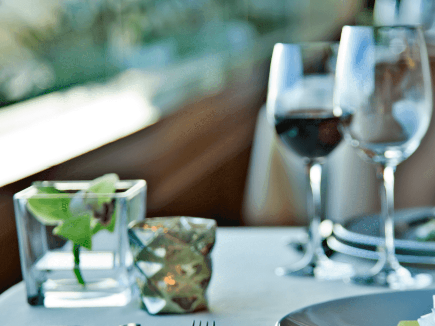 Close-up of dining table arranged with wines at Hotel Cascais Miragem Health & Spa