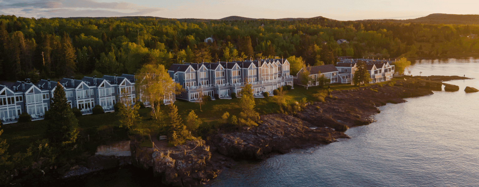 Distant exterior view of Bluefin Bay by Lake Superior