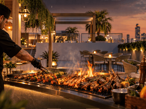 Live BBQ station featuring freshly grilled meats, seafood, and barbecue specialties prepared fresh throughout the evening