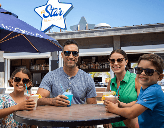 A family enjoys frozen drinks at our Diamond Beach NJ hotel