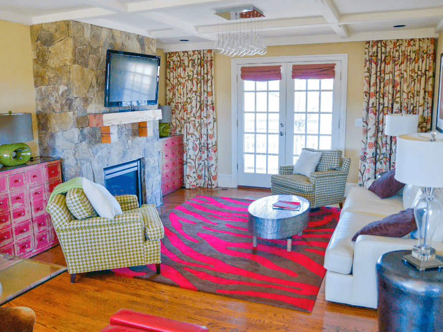 The Overlook West living room with a two cozy chairs and Tv in Inn at Willow Grove