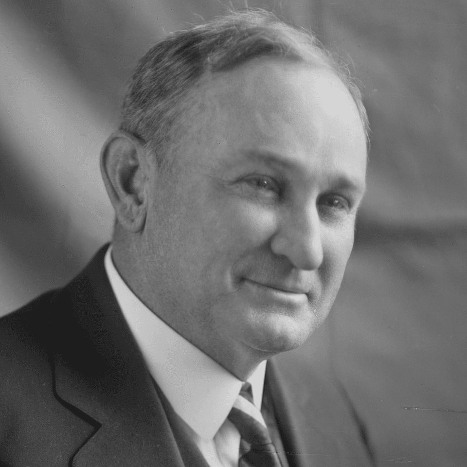 Black and white portrait of Joseph T. Robinson in a suit and striped tie, displayed near Arlington Resort Hotel & Spa
