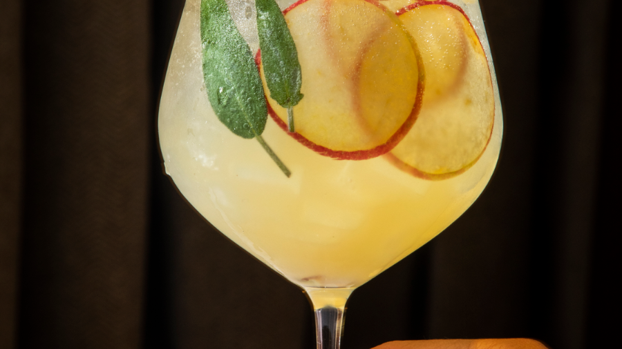 Close-up of holding a cocktail, Rugby Grille, Townsend Hotel