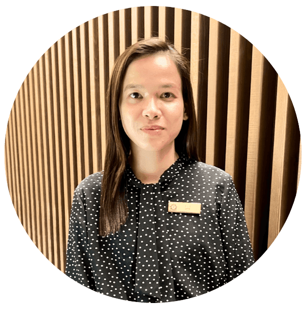 Marie Cris Mariano, Guest Service Agent at Park Hotel Kyoto, assisting a guest at the reception desk.