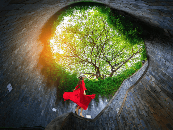 A woman in red dress at Fort Canning near Paradox Singapore