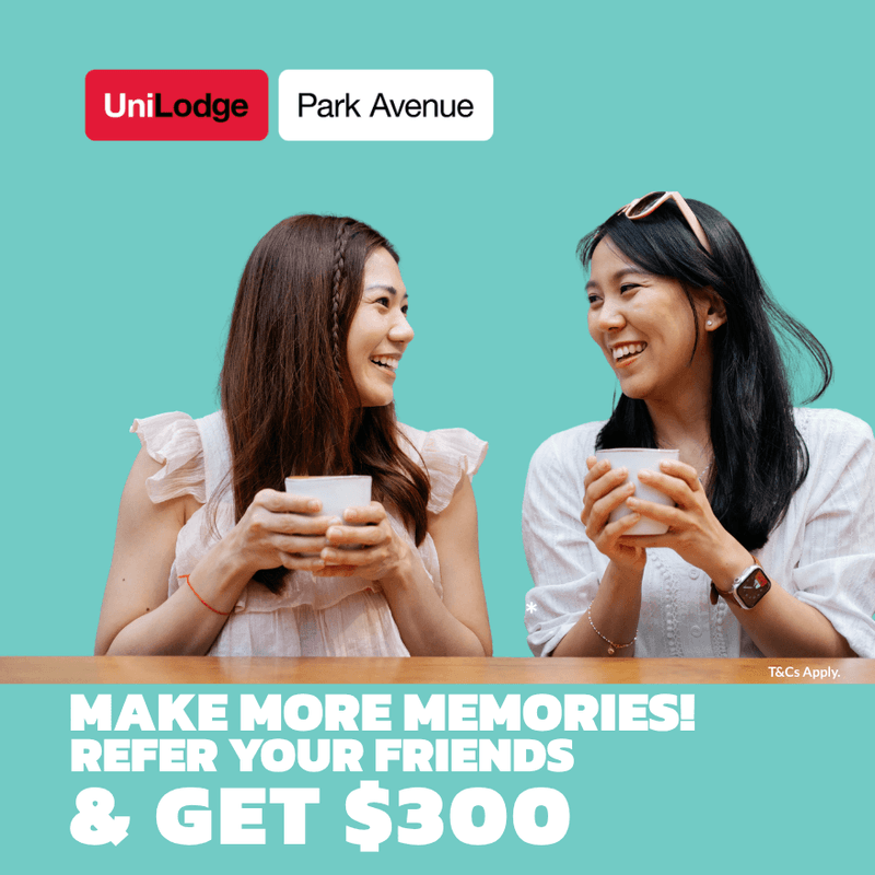 Two female students holding coffee cups against a turquoise background with UniLodge Park Avenue branding and referral promotion.