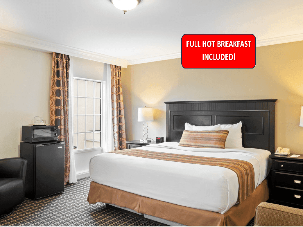 Bedroom with an outdoor view in King Superior at The Wilshire Grand Hotel