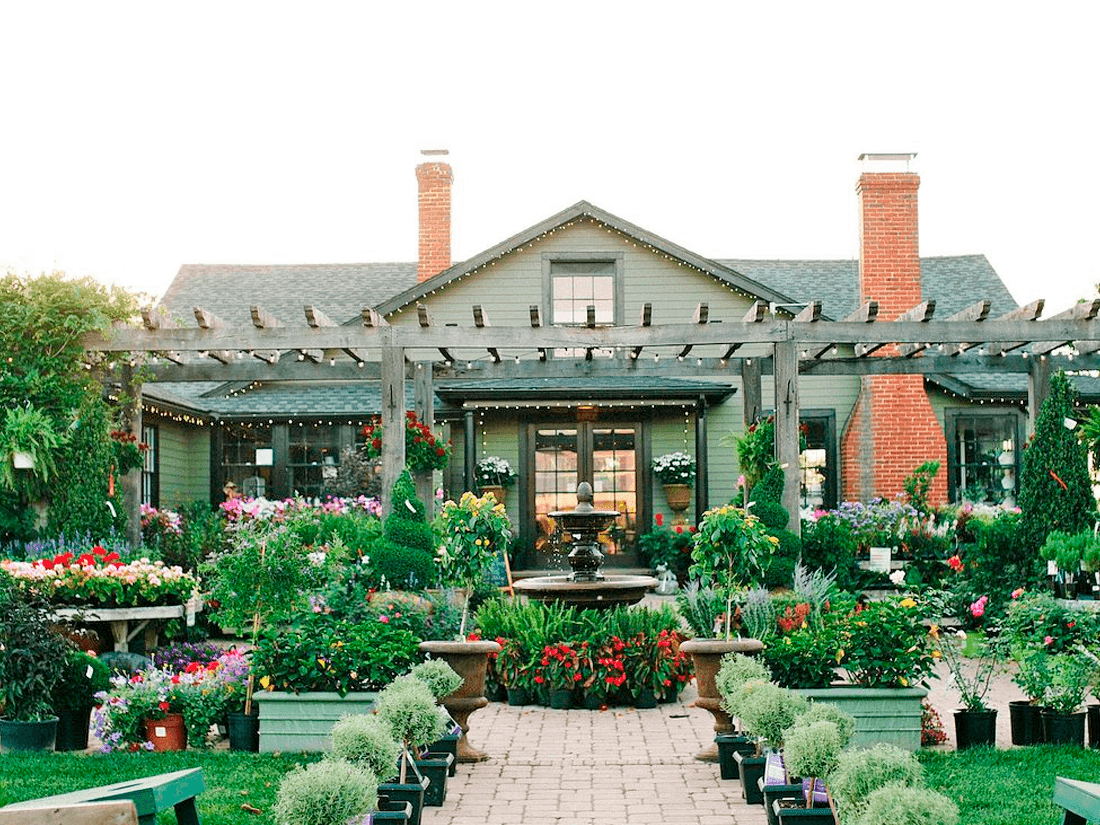 Exterior view of The Market At Grelen House with a fountain and Various Plants near Inn at Willow Grove