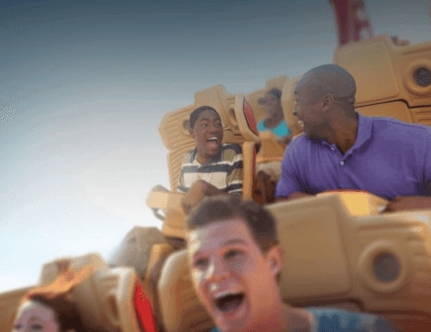 Group of people riding a roller coaster near Rosen Inn Hotels and Resorts