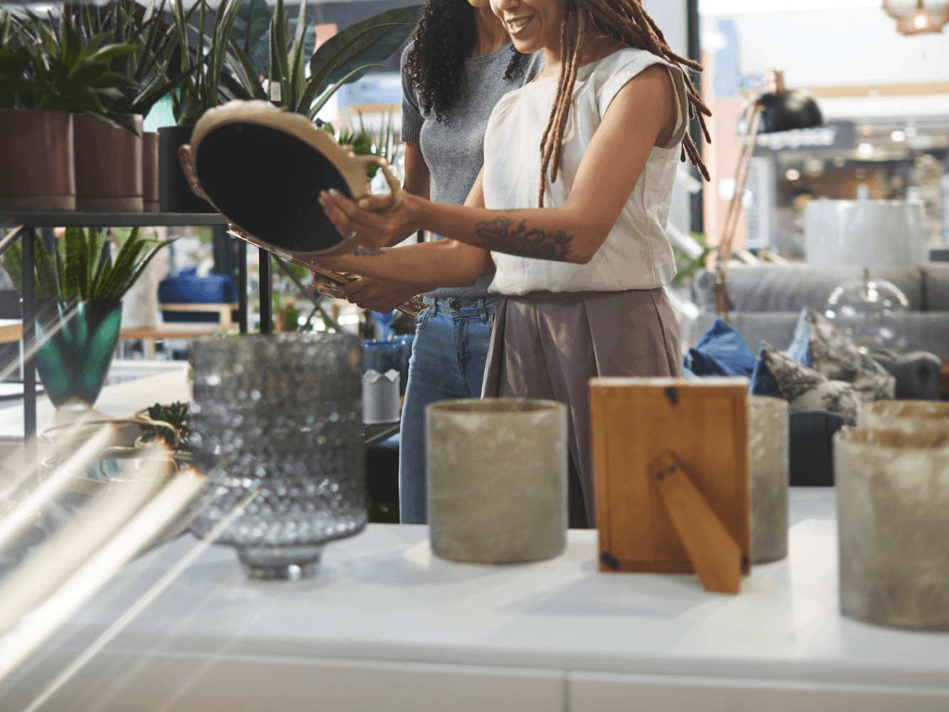 Two Women admiring ornaments in a Boutique Store near Juniper Hill Inn