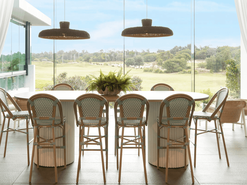 Dining set-up in Shallows Bar overlooking the golf course at Pullman Magenta Shores