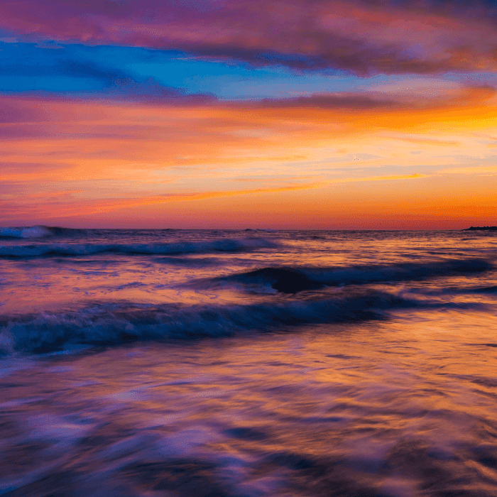 colorful cape may sunset with shades of purple blue and orange over the bay