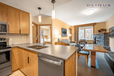 Comfortable suite at Falcon Crest Lodge features a well-equipped kitchen with a breakfast bar, a dining table