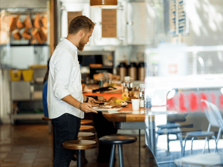 Waiter serving the food