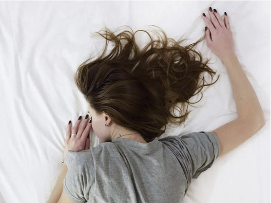 A girl, sleeping on her stomach at Hotel Luma Hammersmith