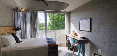 Estandar Bedroom with a king bed at El Blok Hotel