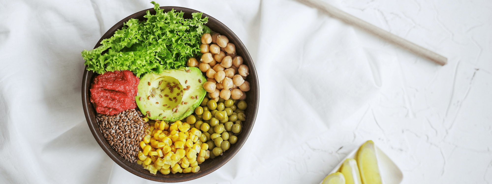 Bowl of grains, avocado, meat and salad leaves at Crown Hotels