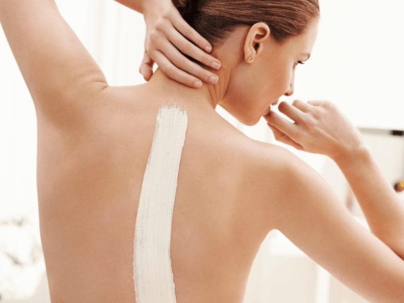 Lady getting a body treatment in a spa at Live Aqua Resorts