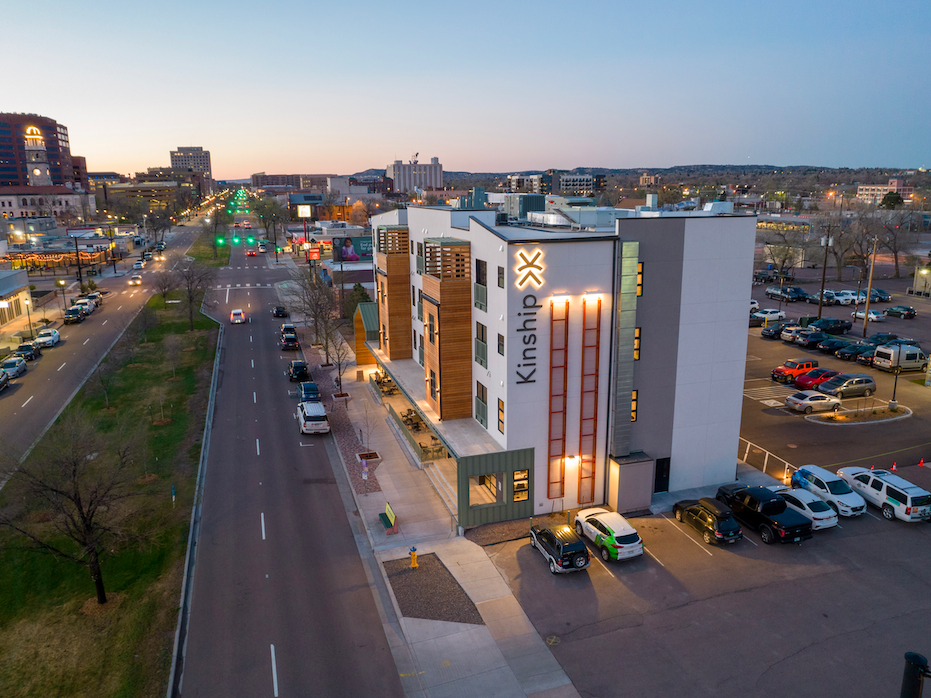 Aerial shot of Kinship Landing Hotel middle in the city