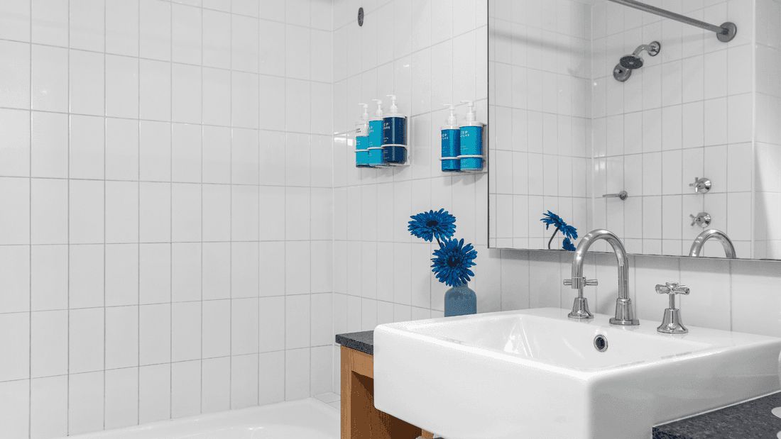 Standard bathroom with sink and shower over a bathub