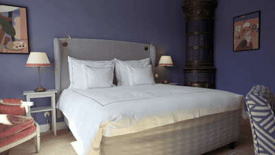 Interior of deluxe room with a king bed at The Sparrow Hotel