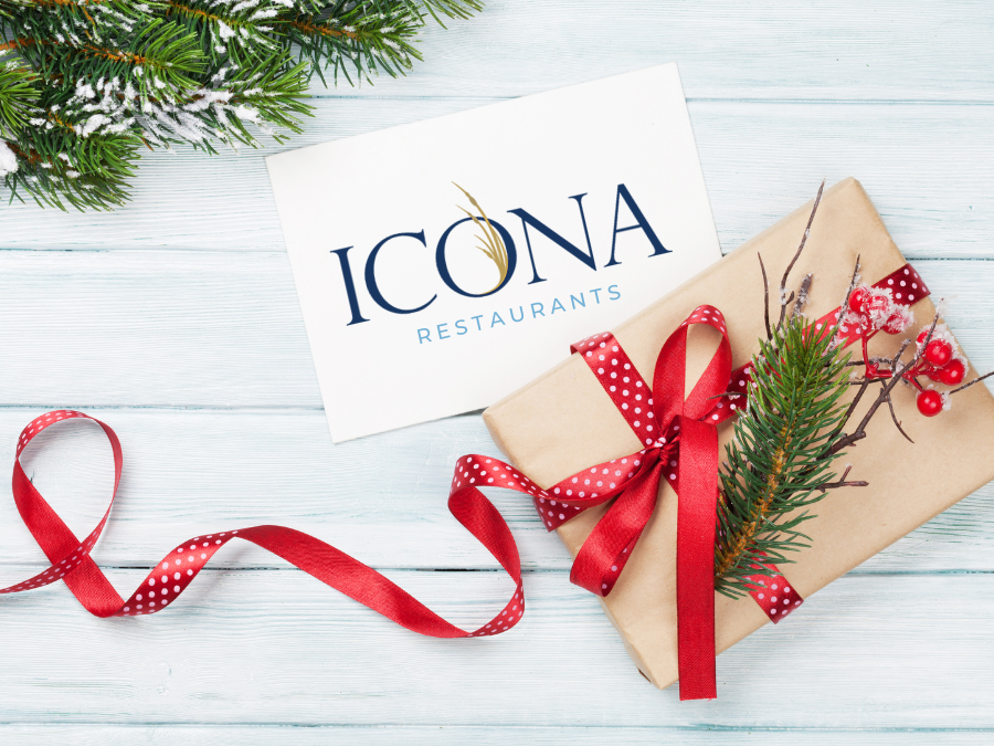 ICONA Restaurants Gift card sale! Gift card sitting on white table with holiday gift wrap.