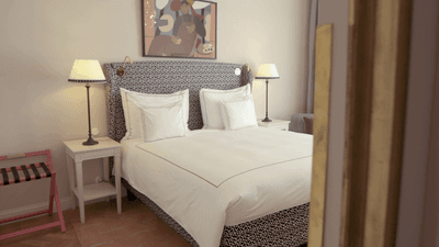 Bed & lamps in the Superior King Room at The Sparrow Hotel