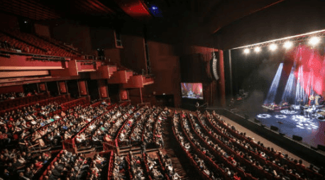 View of a crowd enjoying a performance in Crown Theatre near Nesuto Curtin