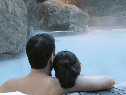 Couple relaxing in the hot spring pool at Harrison Hot Springs Resort