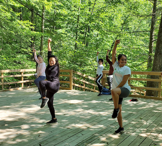 People engage in healing Qi-gong near Honor’s Haven Retreat