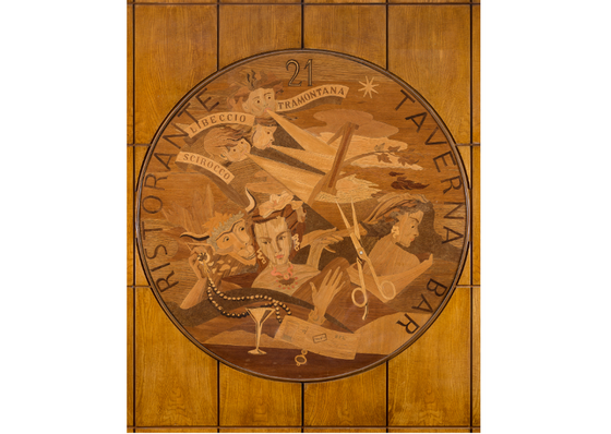 Circular wood panel with a painting at Bettoja Hotels Group 