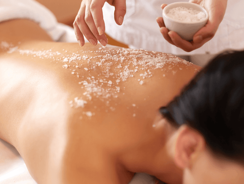 Lady having sugar scrub in spa at Manteo Resort Waterfront