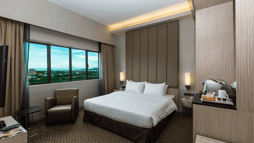 Wooden hangers and an Iron Board in Deluxe Plus King at Sunway Hotel Big Box