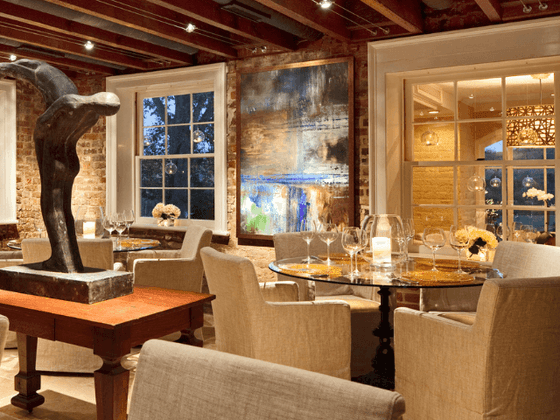 Interior of restaurant with comfortable chairs and round tables at the inn at Willow grove