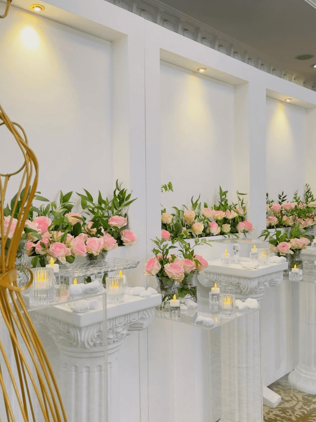 Elegantly decorated Coral Room with flowers and candles at Warwick Doha.