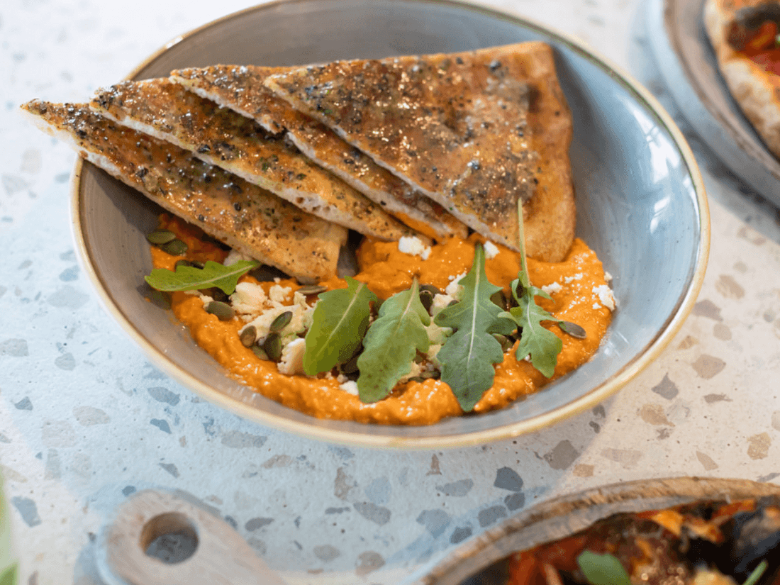 Close-up of Pizza served in Shallows Bar at Pullman Magenta Shores