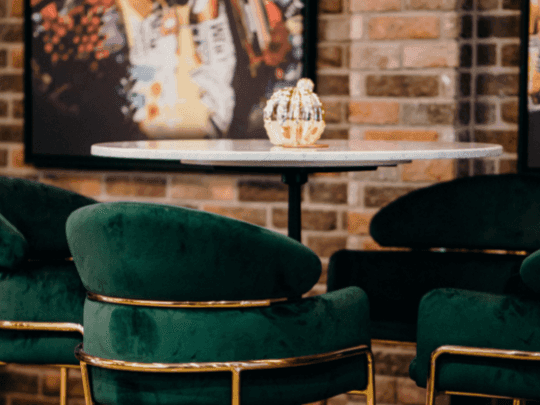 Dining table with loungers in Melrose Bar and Louge at Paramount Hotel Midtown