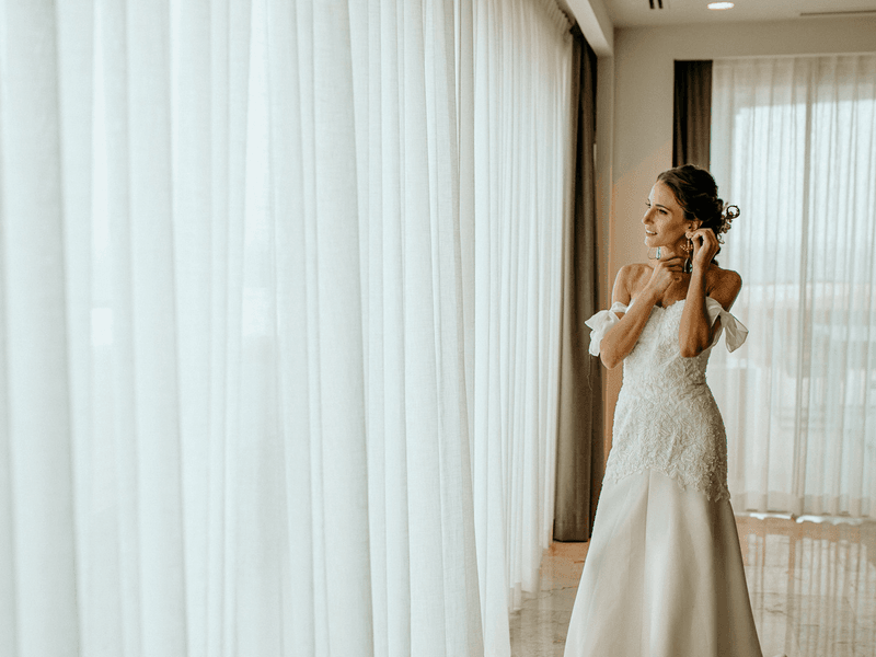 Bride getting ready by a window at Fiesta Americana Mexico