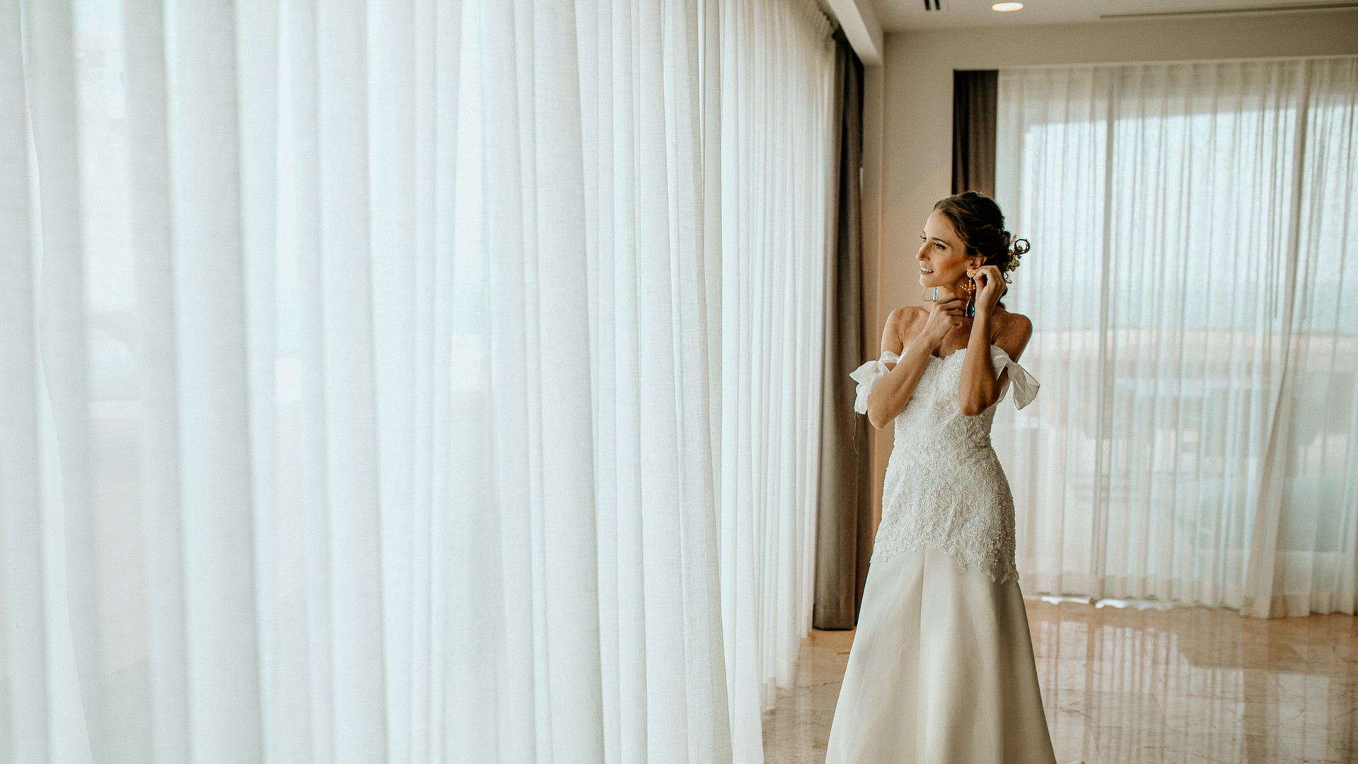 Bride getting ready by a window at Fiesta Americana Mexico