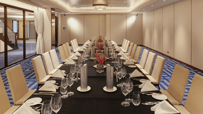 Balinga with place settings and floral centerpieces, draped in black linen at The Grace Sydney