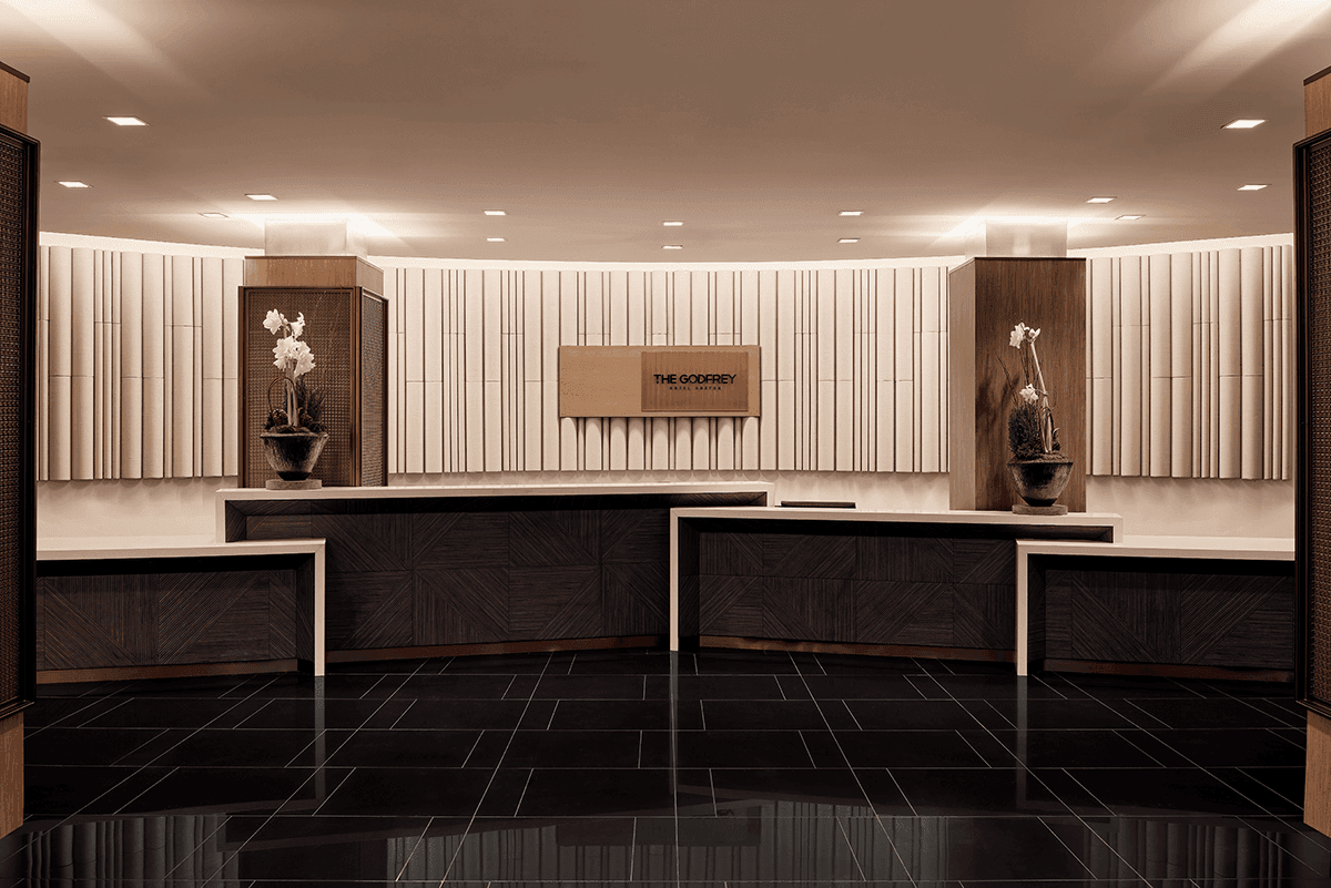 The lobby and reception desk of The Godfrey Hotel Boston