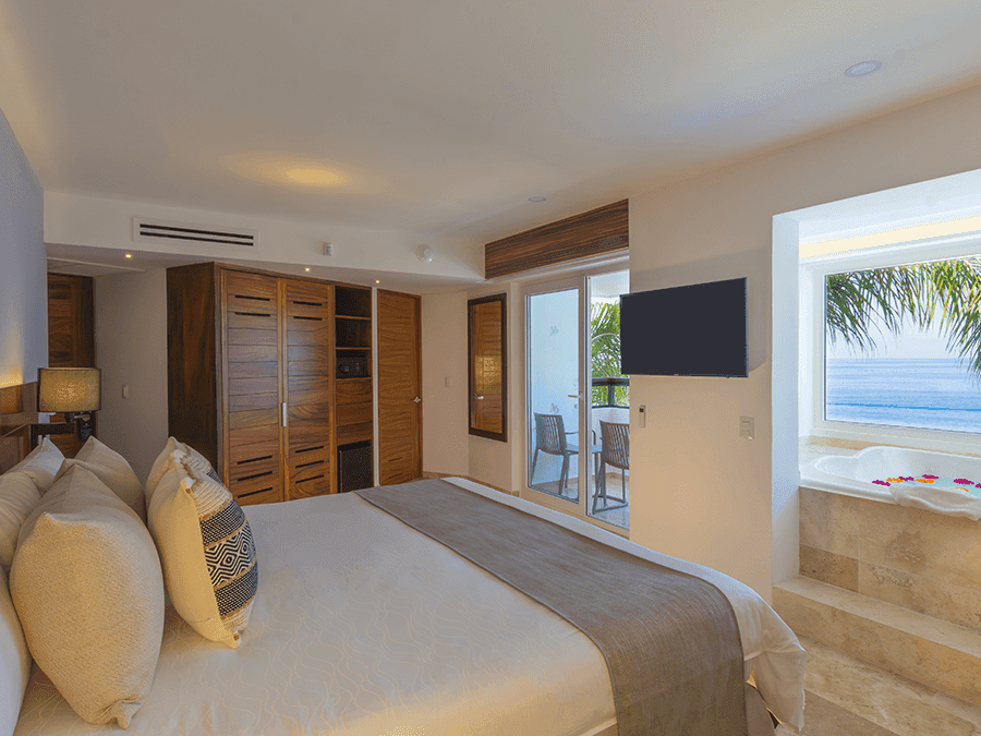 Interior of Honeymoon Suite with ocean view, part of the terrace and the jacuzzi.