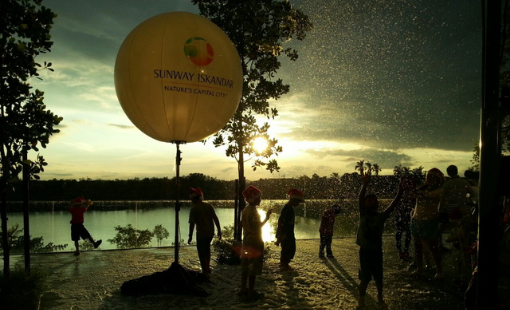 Sunset by a lake with kids and an air balloon at Sunway Iskandar near Sunway Hotel Big Box