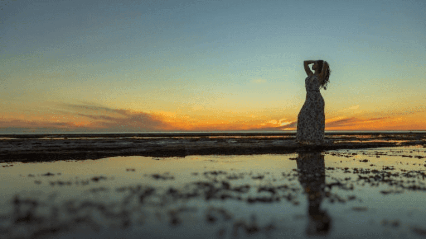 Woman posing on the beach near Peñasco del Sol Hotel
