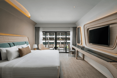 Interior of a Room with modern architecture and a balcony overlooking the garden at Amora Hotel