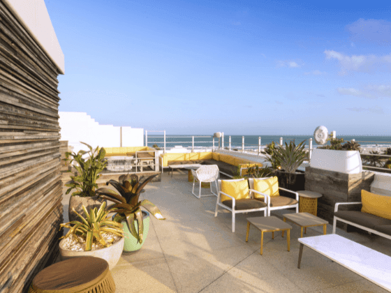 A view of C-level Rooftop Terrace with beach view at Essex House by Clevelander