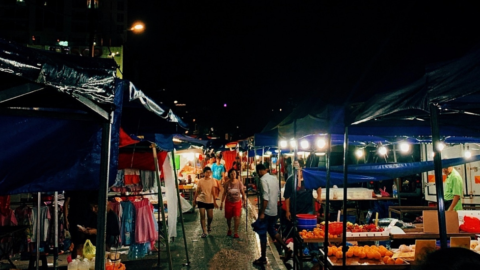 Night market scene with stalls and shoppers in Johor Bharu City Center near Sunway Hotel Big Box