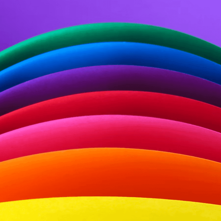 Curved lines forming a rainbow against a purple background used at Warwick Brussels